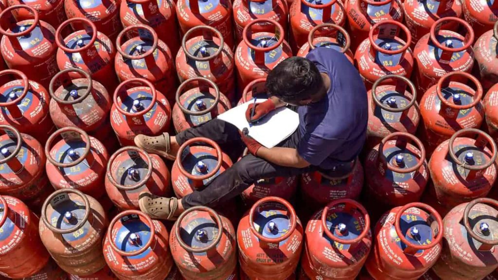 A-worker-sits-over-LPG-cylinders-during-distribution-at-a-gas-agency-1-1536x864