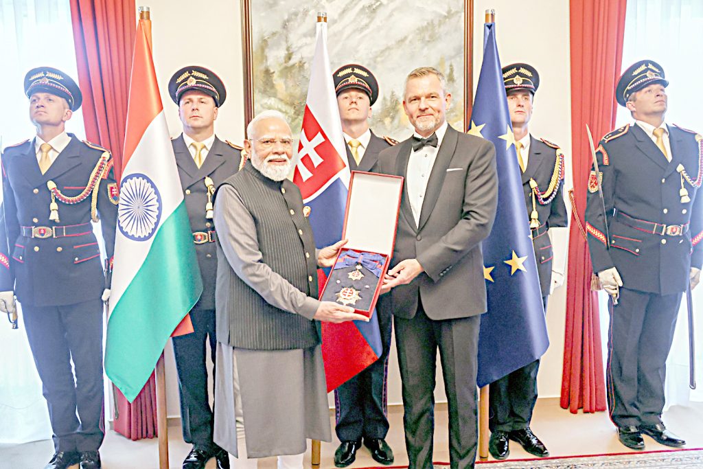 Slovak President Peter Pellegrini presents the highest state honour of Slovakia to PM Modi